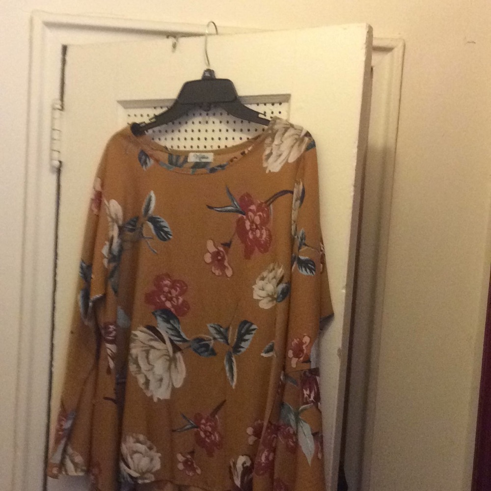 Mustard color flowered blouse bell bottom sleeves.